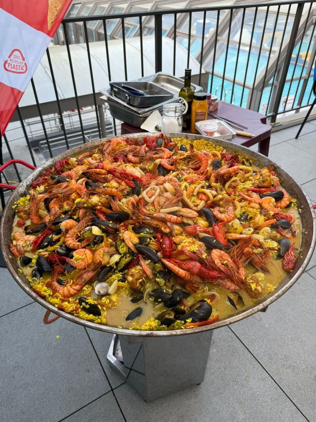 Large seafood paella cooked outdoors